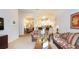 View of a living room with an archway to the kitchen and dining area at 515 Rum Run # 33515, Davenport, FL 33897