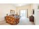 Cozy living room with floral furniture and sliding glass doors to the balcony at 515 Rum Run # 33515, Davenport, FL 33897