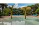 Community splashpad with playful water features and lounge seating offers a refreshing outdoor experience at 515 Rum Run # 33515, Davenport, FL 33897