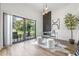 Bright home office features modern desk, decor, and a sliding glass door to balcony for work-from-home comfort at 52 W Harding St # A, Orlando, FL 32806