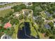 Aerial view highlighting the property's location with a lake view and lush greenery at 530 Lake Bingham Rd, Lake Mary, FL 32746