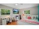 Bedroom featuring TV, mounted on the wall, and colorful decor at 530 Lake Bingham Rd, Lake Mary, FL 32746