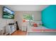 Bedroom showcasing TV, mounted on the wall, and colorful decor at 530 Lake Bingham Rd, Lake Mary, FL 32746