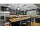 Elegant kitchen features dark wood cabinetry, granite countertops, and stainless steel appliances at 530 Lake Bingham Rd, Lake Mary, FL 32746
