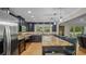 Elegant kitchen features dark wood cabinetry, granite countertops, and stainless steel appliances at 530 Lake Bingham Rd, Lake Mary, FL 32746