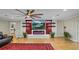 Spacious living room with fireplace, floating shelves, contemporary lighting, and stylish decor at 530 Lake Bingham Rd, Lake Mary, FL 32746