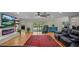 Bright living room with hardwood floors, sliding glass doors leading to the backyard and a modern fireplace at 530 Lake Bingham Rd, Lake Mary, FL 32746