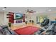 Living room featuring a contemporary fireplace, hardwood floors, and a sliding glass door to the backyard at 530 Lake Bingham Rd, Lake Mary, FL 32746
