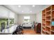 Bright office with hardwood floors, desk, large windows, shelving, and ample storage at 530 Lake Bingham Rd, Lake Mary, FL 32746