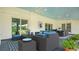 Inviting outdoor patio with comfortable seating area to enjoy the views and fresh air at 530 Lake Bingham Rd, Lake Mary, FL 32746