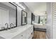 Bathroom with dual vanity, modern lighting, and bedroom view at 5436 Tangerine Ave, Winter Park, FL 32792