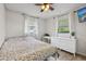 Bright bedroom with natural light, ceiling fan, and light colored walls at 5436 Tangerine Ave, Winter Park, FL 32792
