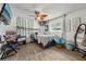 Eclectic bedroom setup with a desk, plants, and unique decor at 5436 Tangerine Ave, Winter Park, FL 32792