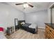 Bedroom with wood look floors, ceiling fan, and closet at 5436 Tangerine Ave, Winter Park, FL 32792