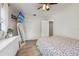Bedroom with television, full-length mirror, and wood-look floors at 5436 Tangerine Ave, Winter Park, FL 32792