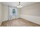 Cozy dining room featuring elegant chandelier, wainscoting, and wood-look tile flooring at 5436 Tangerine Ave, Winter Park, FL 32792