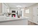 Well-lit kitchen featuring quartz countertops, stainless steel appliances and wood flooring at 5436 Tangerine Ave, Winter Park, FL 32792
