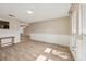 Spacious living room with tiled floors, neutral paint and large window at 5436 Tangerine Ave, Winter Park, FL 32792