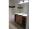 Bathroom featuring modern vanity with ample storage and sleek fixtures at 6021 Westgate Dr # 813, Orlando, FL 32835
