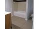 Well-lit bathroom featuring a bathtub with shower and a modern vanity with storage at 6021 Westgate Dr # 813, Orlando, FL 32835
