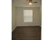 Bright bedroom with hardwood floors, ceiling fan, and window for natural light at 6021 Westgate Dr # 813, Orlando, FL 32835