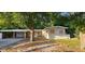 Quaint one-story home featuring a covered carport and a spacious yard, ideal for outdoor activities at 6113 Hialeah St, Orlando, FL 32808