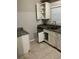 Functional kitchen space features essential appliances and ample cabinet storage at 6113 Hialeah St, Orlando, FL 32808