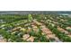 Aerial view of a residential neighborhood with tree-lined streets, well-maintained homes and community landscaping at 6233 Rydal Ct, Windermere, FL 34786