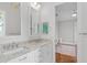 A bright bathroom with double sinks, granite countertops, and ample lighting at 6233 Rydal Ct, Windermere, FL 34786
