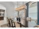 Open dining area with modern chandelier and neutral colors at 6233 Rydal Ct, Windermere, FL 34786