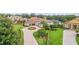 Aerial view of a home with a circular driveway, mature landscaping, and a well-manicured lawn at 6233 Rydal Ct, Windermere, FL 34786