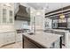 Gourmet kitchen with a large island, stainless steel appliances, and custom cabinetry at 6233 Rydal Ct, Windermere, FL 34786