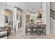 Open kitchen area features an island with bar seating and modern lighting at 6233 Rydal Ct, Windermere, FL 34786