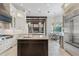 A gourmet kitchen features a center island, stainless appliances, and custom cabinetry at 6233 Rydal Ct, Windermere, FL 34786