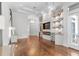 Open-concept living room featuring hardwood floors, custom built-ins, and a seamless flow to the outdoor area at 6233 Rydal Ct, Windermere, FL 34786