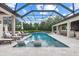 A stunning private screened-in pool area with bar and multiple seating options at 6233 Rydal Ct, Windermere, FL 34786