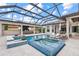 Stunning pool area featuring a spa, bar, and covered seating, ideal for relaxation and entertainment at 6233 Rydal Ct, Windermere, FL 34786