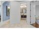View of the powder room with unique vanity and decorative mirror, adjacent to a home office at 6233 Rydal Ct, Windermere, FL 34786