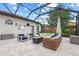 Inviting screened patio featuring a fire pit and comfortable seating, perfect for year-round enjoyment at 6233 Rydal Ct, Windermere, FL 34786
