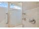 Modern walk-in shower with dual shower heads, tiled walls, and ample natural light at 6233 Rydal Ct, Windermere, FL 34786