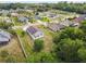 An aerial view features homes with solar panels, backyards, and landscaping in a quiet neighborhood at 7243 Minippi Dr, Orlando, FL 32818