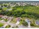 A residential area featuring single-story homes with well-maintained lawns, solar panels, and scenic landscaping at 7243 Minippi Dr, Orlando, FL 32818