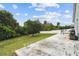 Large backyard with concrete patio, ideal for outdoor gatherings and enjoying the serene, wooded surroundings at 7243 Minippi Dr, Orlando, FL 32818