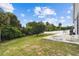 Expansive backyard with concrete patio, perfect for outdoor entertaining and enjoying the peaceful, tree-lined scenery at 7243 Minippi Dr, Orlando, FL 32818