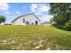 Exterior of home with a spacious backyard and patio, creating a relaxing outdoor oasis at 7243 Minippi Dr, Orlando, FL 32818