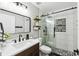 Bathroom featuring a glass-enclosed shower with black fixtures, and a vanity with a modern sink at 7243 Minippi Dr, Orlando, FL 32818