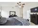 Bedroom featuring tiled floors, a black dresser, a television, and a door leading to the bathroom at 7243 Minippi Dr, Orlando, FL 32818