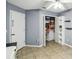 Spare bedroom with ceiling fan, ceramic tile floors, closet and extra shelving at 7243 Minippi Dr, Orlando, FL 32818