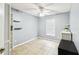 Bright bedroom with ceiling fan, ceramic tile floors, a closet and extra shelving at 7243 Minippi Dr, Orlando, FL 32818