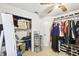 Walk-in closet with clothing racks, storage shelves, and door to another space at 7243 Minippi Dr, Orlando, FL 32818